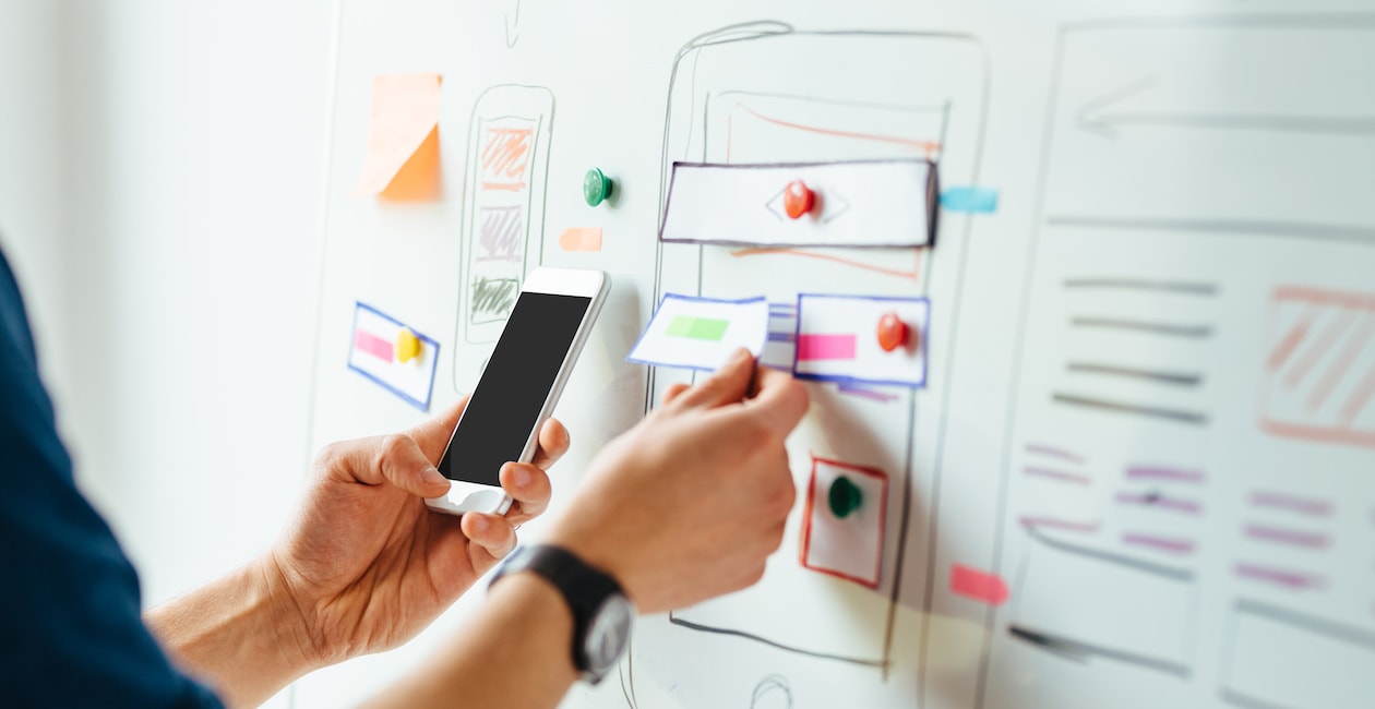 Engaging image depicting a UX designer at work, highlighting the importance of user research in design.