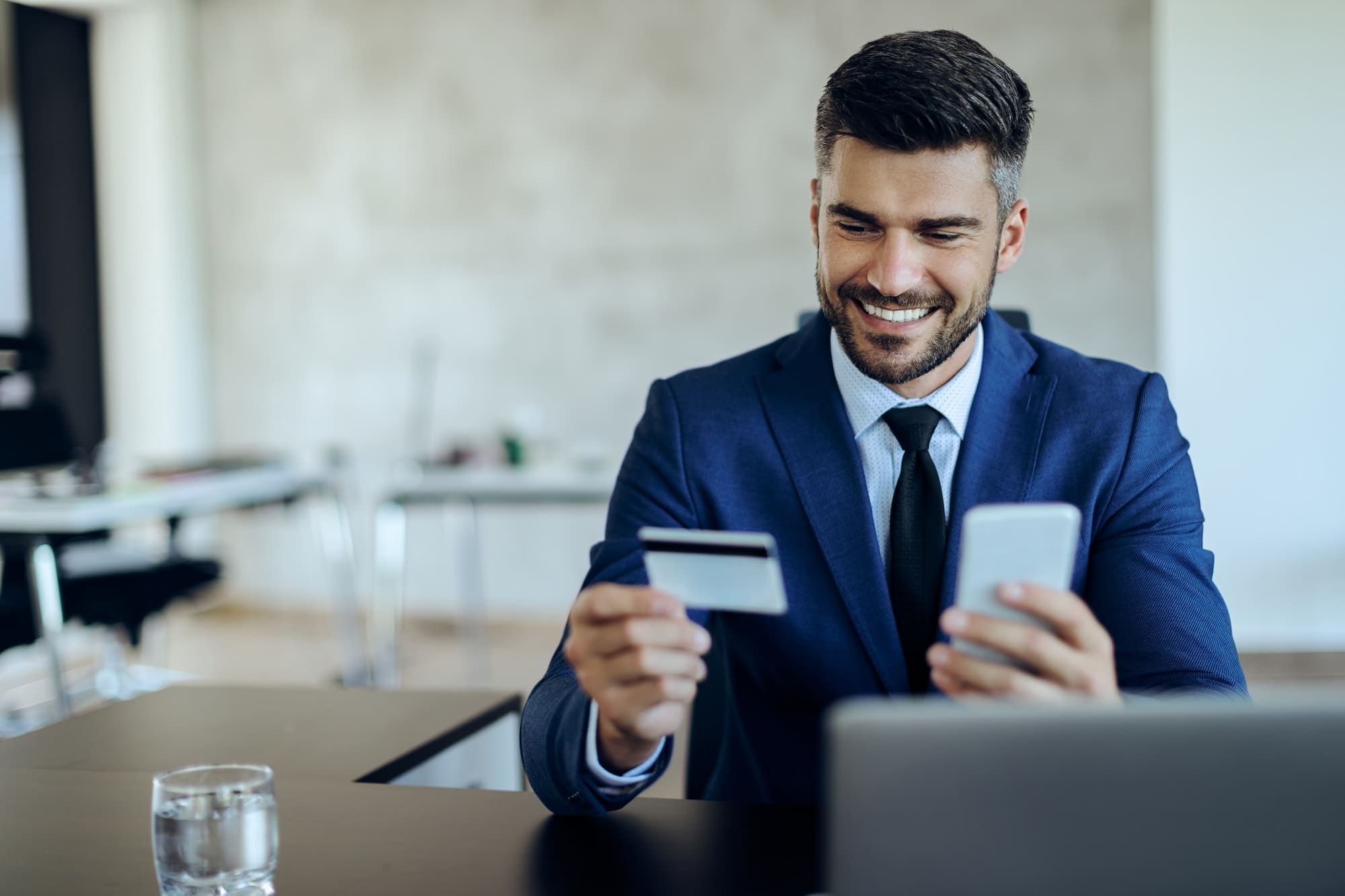 Smiling customer using a banking app on their phone