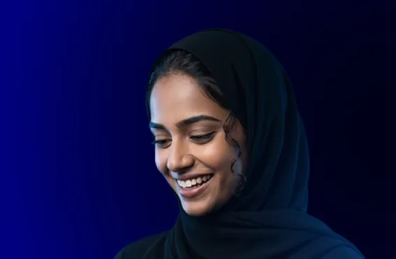 Smiling bank customer using a mobile banking app and payment card, highlighting bank website marketing, mobile responsiveness, and user-friendly mobile design.